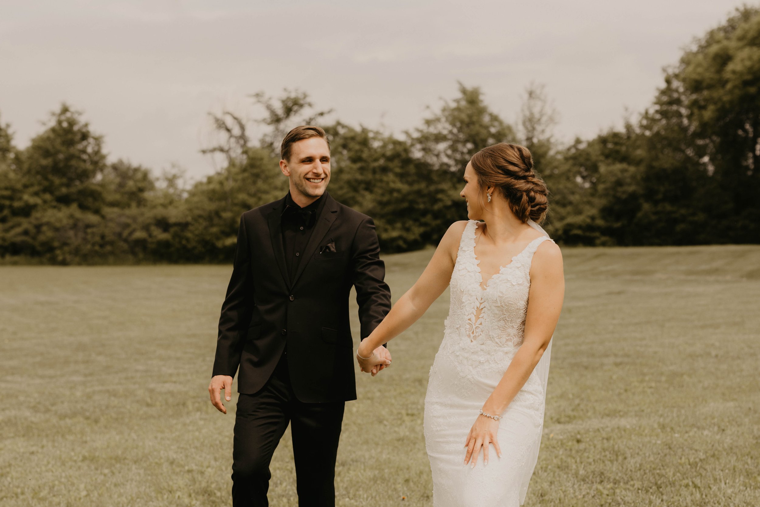 Bride and Groom holding hands