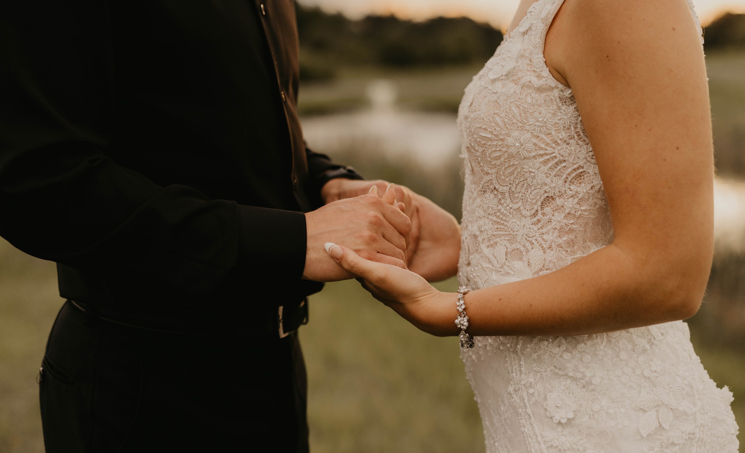 bride and groom holding hands