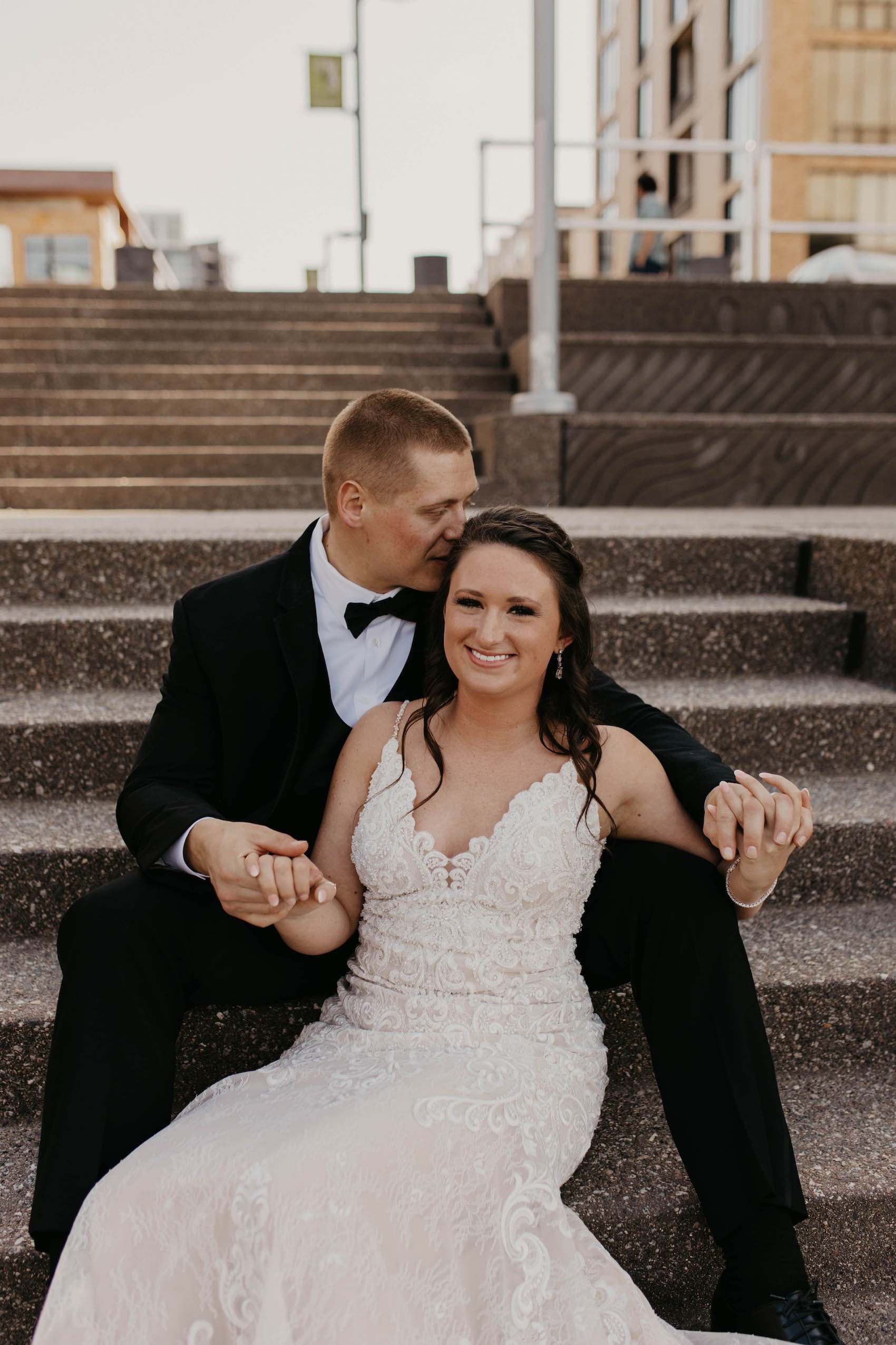 bride and groom sitting on stairs.jpg