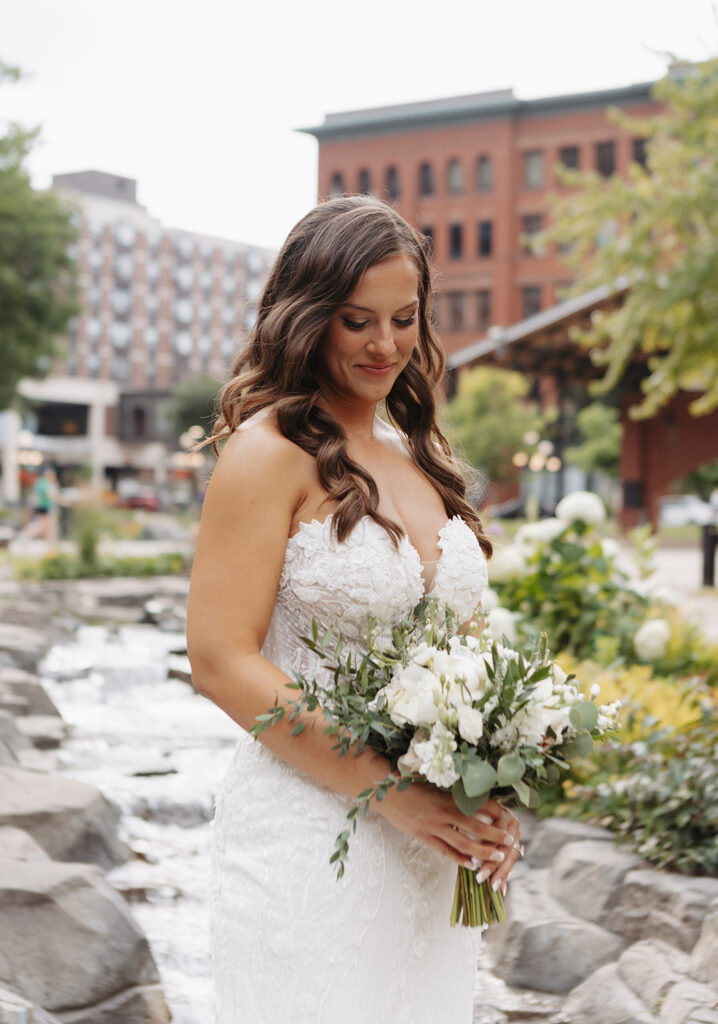 bride looking at her flowers